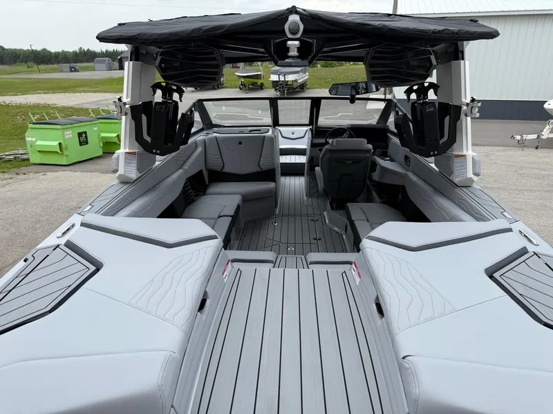 Slide: The Image of 2025 Nautique Super Air Nautique G23 interior with sleek gray seating and modern design. - 22
