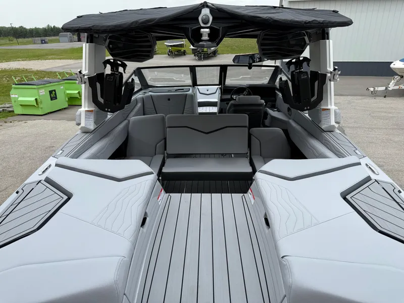 Slide: The Image of 2025 Nautique Super Air Nautique G23 boat interior with sleek gray seating and modern design. - 23
