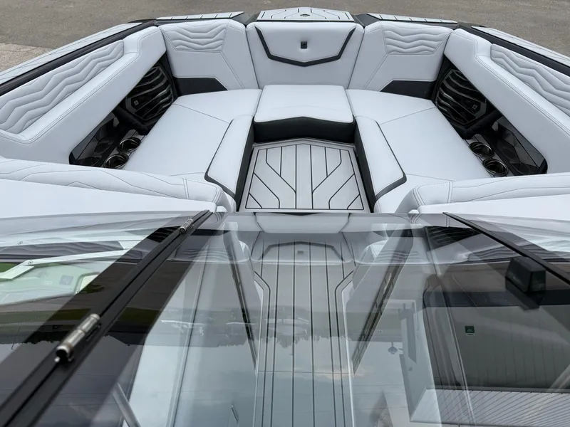 Slide: The Image of 2025 Nautique Super Air Nautique G23 interior with luxurious seating and modern design. - 24
