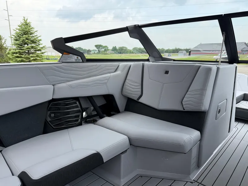 Slide: The Image of 2025 Nautique Super Air Nautique G23 interior with sleek, modern seating and stylish design. - 28