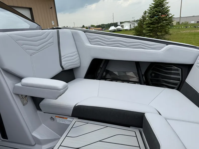 Slide: The Image of 2025 Nautique Super Air Nautique G23 interior with sleek, modern seating design. - 29