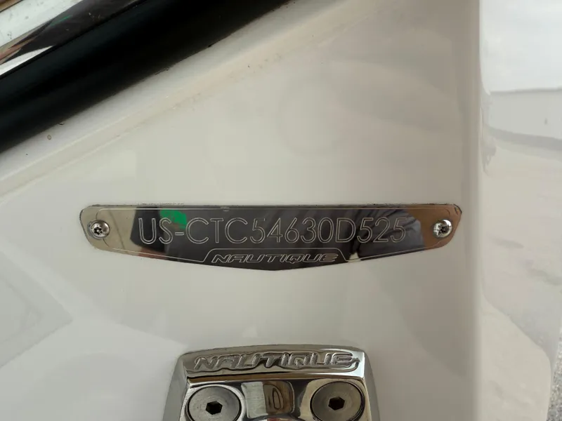 Slide: The Image of 2025 Nautique Super Air Nautique G23 hull identification number plate. - 32