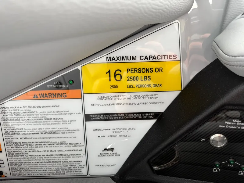 Slide: The Image of 2025 Nautique Super Air Nautique G23 capacity label, 16 persons or 2500 lbs, safety warnings visible. - 41