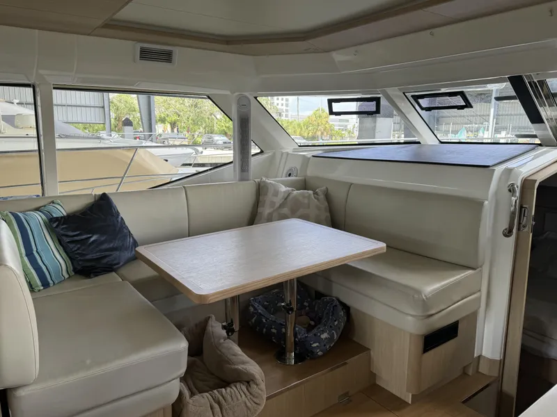 Slide: The Image of Interior of 2020 Aquila 44 Yacht with cozy seating and table. - 5