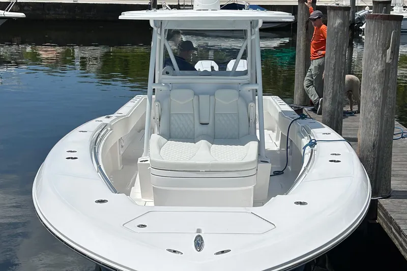 Slide: The Image of 2023 Invincible 36 Open Fisherman boat docked, featuring sleek design and spacious seating. - 6