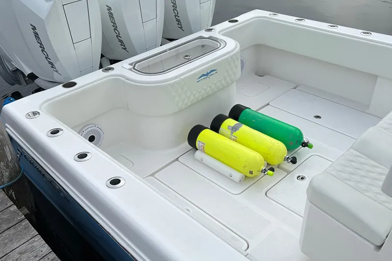 Slide: The Image of 2023 Invincible 36 Open Fisherman boat deck with scuba tanks and Mercury engines. - 9