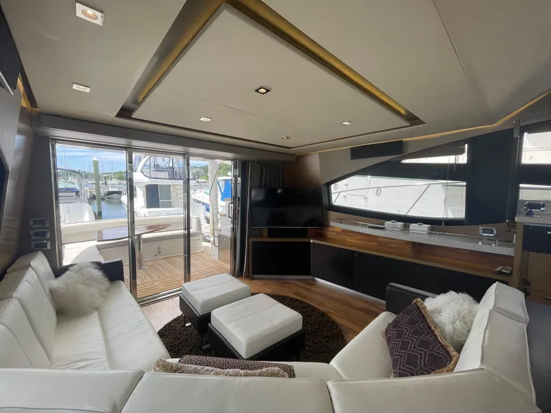 Slide: The Image of Luxurious interior of 2017 Sea Ray L590 Fly yacht with modern furnishings and marina view. - 10