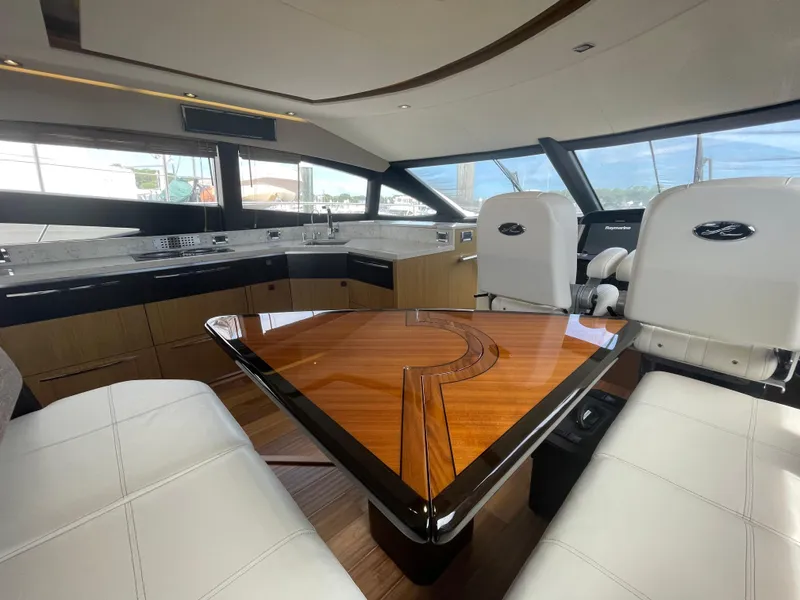 Slide: The Image of Luxurious interior of 2017 Sea Ray L590 Fly yacht with elegant seating and modern kitchen. - 12