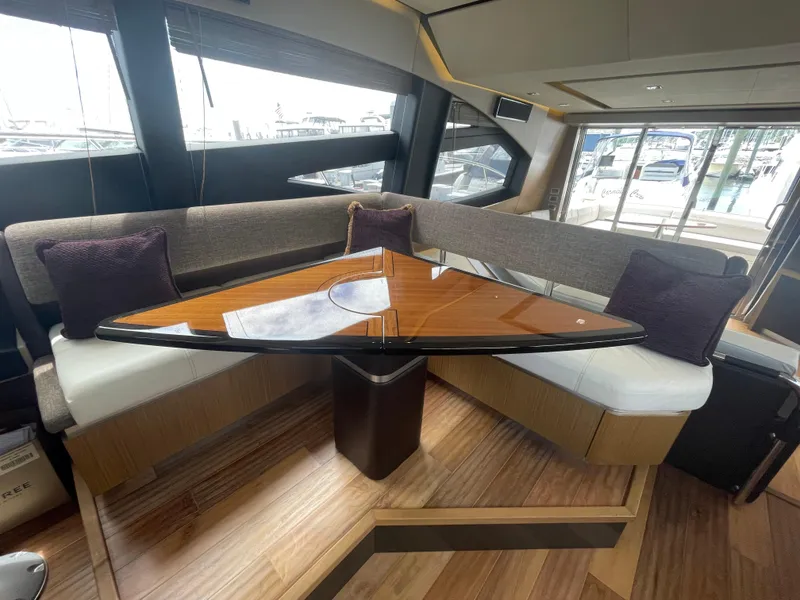 Slide: The Image of Luxurious interior of 2017 Sea Ray L590 Fly yacht with elegant seating and wooden table. - 13