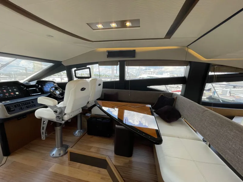 Slide: The Image of Luxurious interior of 2017 Sea Ray L590 Fly yacht with helm and seating area. - 14