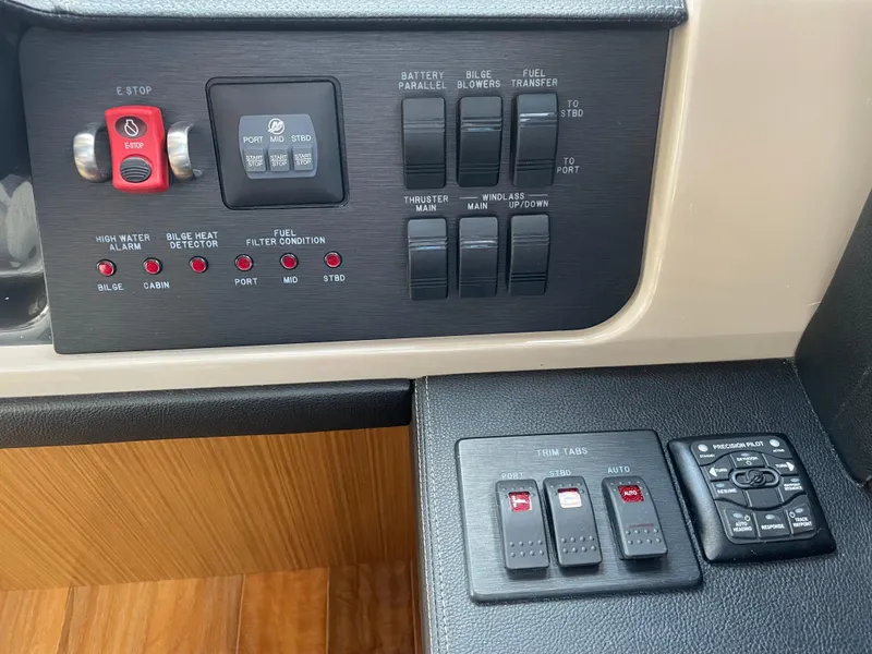 Slide: The Image of Control panel of a 2017 Sea Ray L590 Fly yacht with various switches and indicators. - 17