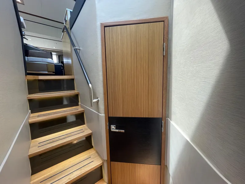 Slide: The Image of Staircase and door inside 2017 Sea Ray L590 Fly yacht interior. - 21