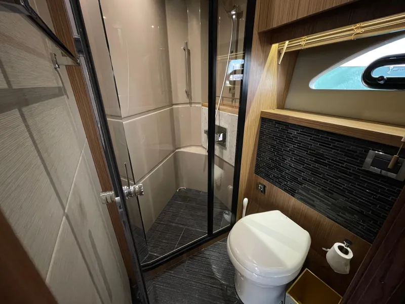 Slide: The Image of Luxurious bathroom in 2017 Sea Ray L590 Fly yacht with modern shower and toilet. - 23