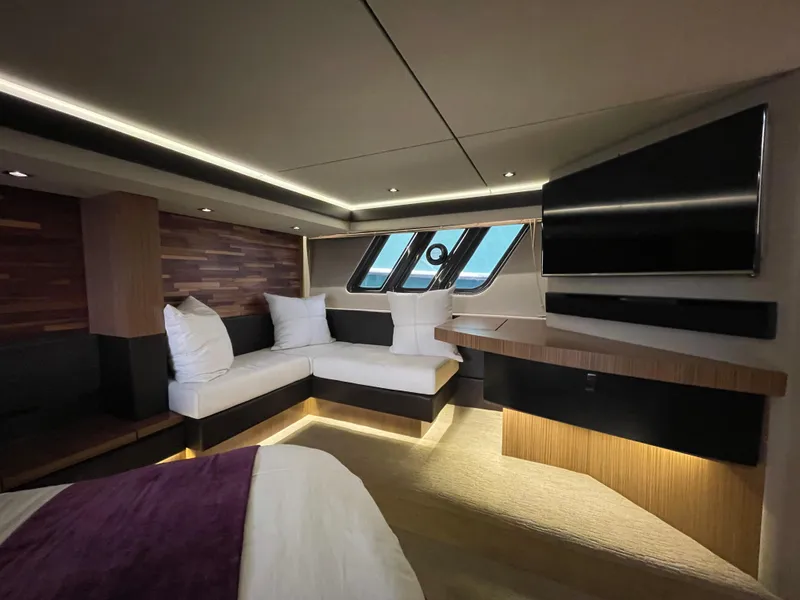 Slide: The Image of Luxurious interior of 2017 Sea Ray L590 Fly yacht with modern seating and ambient lighting. - 28