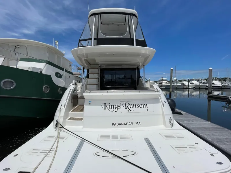 Slide: The Image of 2017 Sea Ray L590 Fly yacht docked at marina, named "King's Ransom," Padarnaram, MA. - 3