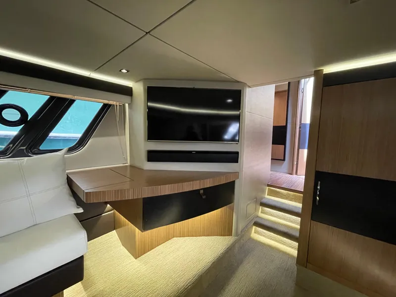 Slide: The Image of Luxurious interior of 2017 Sea Ray L590 Fly yacht with modern furnishings and TV. - 31