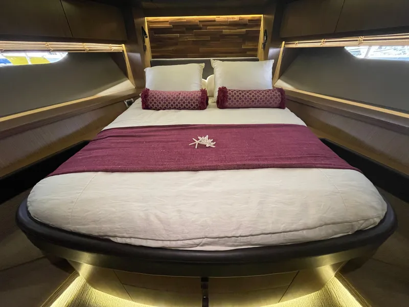 Slide: The Image of Luxurious bedroom interior of 2017 Sea Ray L590 Fly yacht with elegant bedding and ambient lighting. - 35