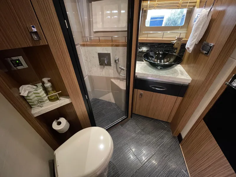 Slide: The Image of Luxurious bathroom in 2017 Sea Ray L590 Fly yacht with modern fixtures and elegant design. - 37
