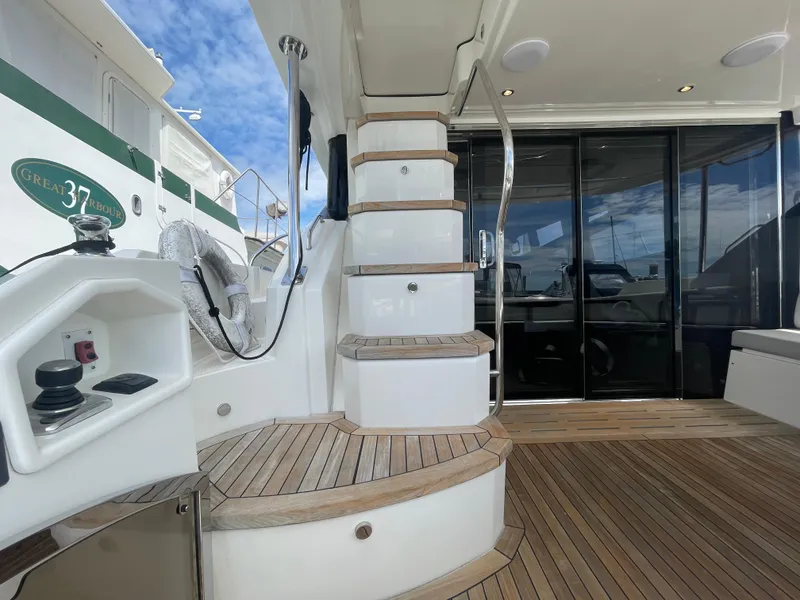 Slide: The Image of Luxurious 2017 Sea Ray L590 Fly yacht with elegant wooden deck and modern staircase. - 4