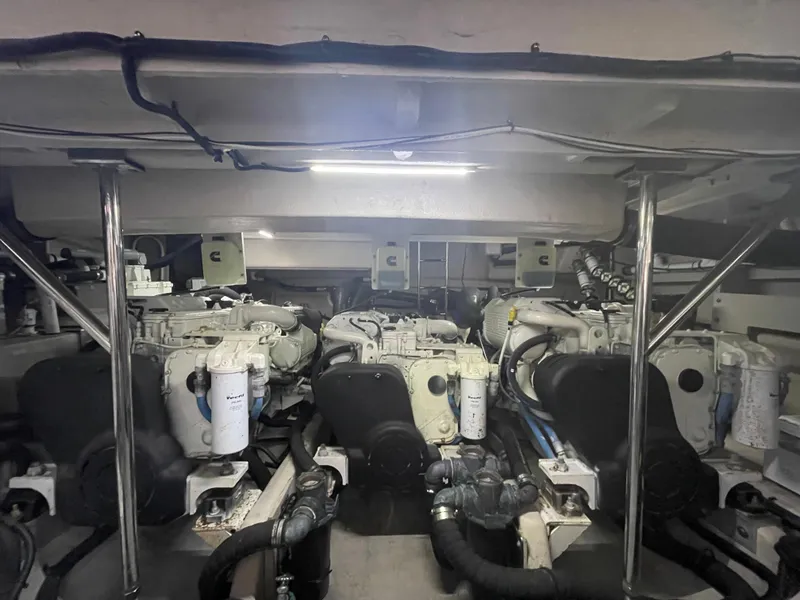 Slide: The Image of Engine room of 2017 Sea Ray L590 Fly yacht, showcasing dual engines and mechanical components. - 49