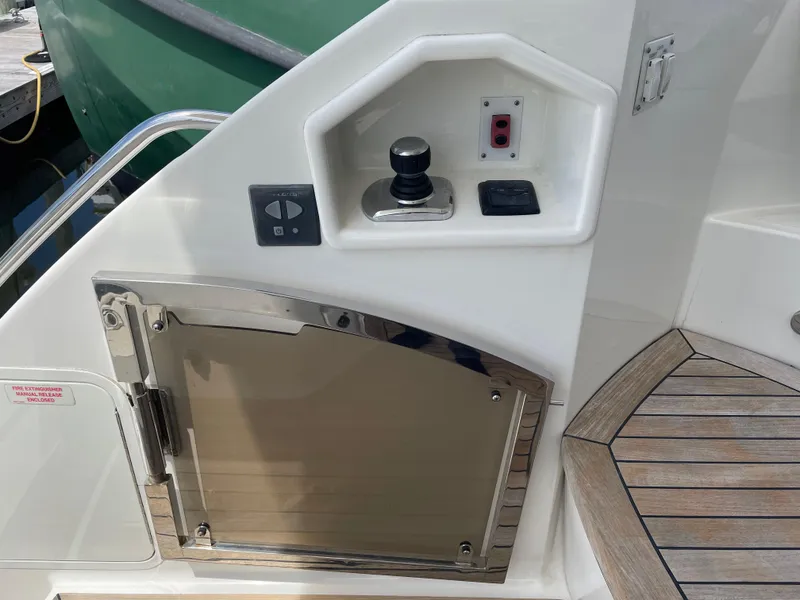 Slide: The Image of Control panel and storage on 2017 Sea Ray L590 Fly yacht deck. - 5