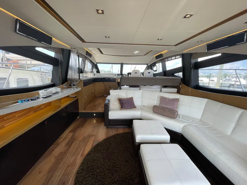 Slide: The Image of Luxurious interior of 2017 Sea Ray L590 Fly yacht with modern furnishings and panoramic windows. - 8