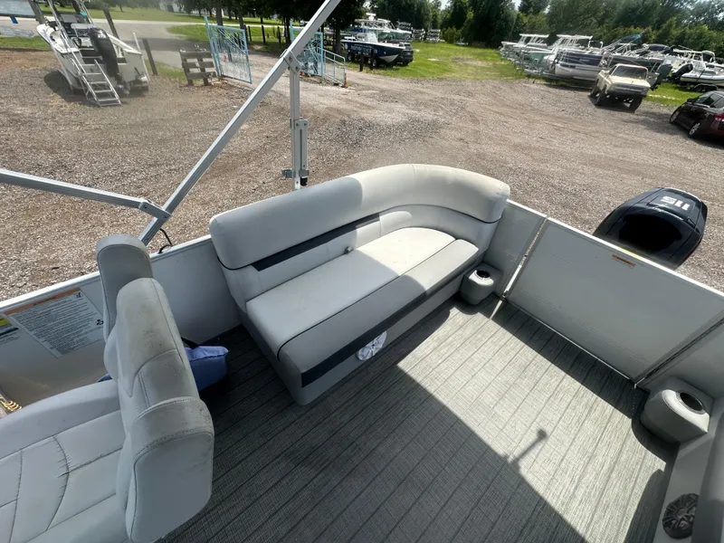 Slide: The Image of Interior of 2021 Godfrey SWEETWATER 2186 SB pontoon boat with seating and outboard motor. - 11