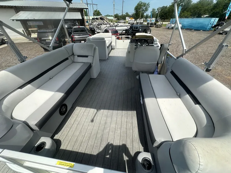 Slide: The Image of 2021 Godfrey SWEETWATER 2186 SB pontoon boat interior with spacious seating and steering console. - 18