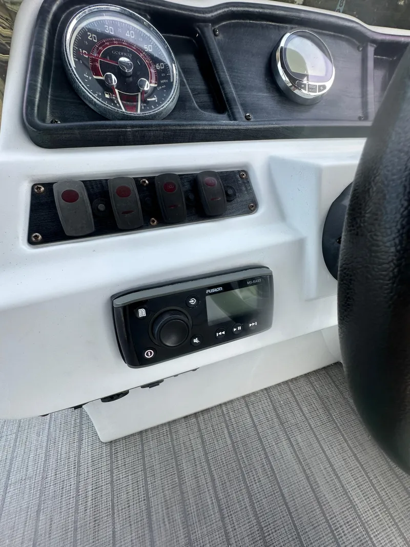 Slide: The Image of Dashboard of 2021 Godfrey SWEETWATER 2186 SB boat with controls and gauges. - 20