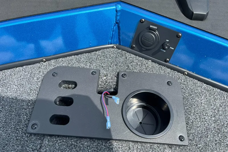 Slide: The Image of 2026 Lund 1775 Renegade SS boat interior with cup holder and control panel. - 13