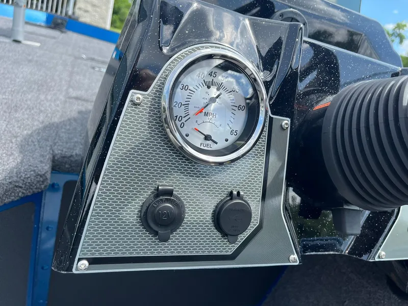 Slide: The Image of Dashboard of 2026 Lund 1775 Renegade SS boat with speedometer and power outlets. - 18