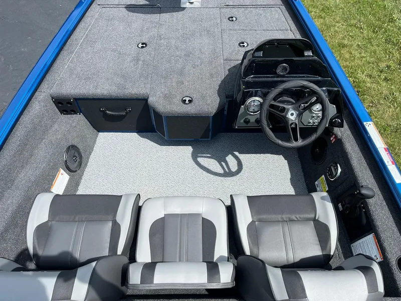 Slide: The Image of 2026 Lund 1775 Renegade SS boat interior with steering console and seating. - 6