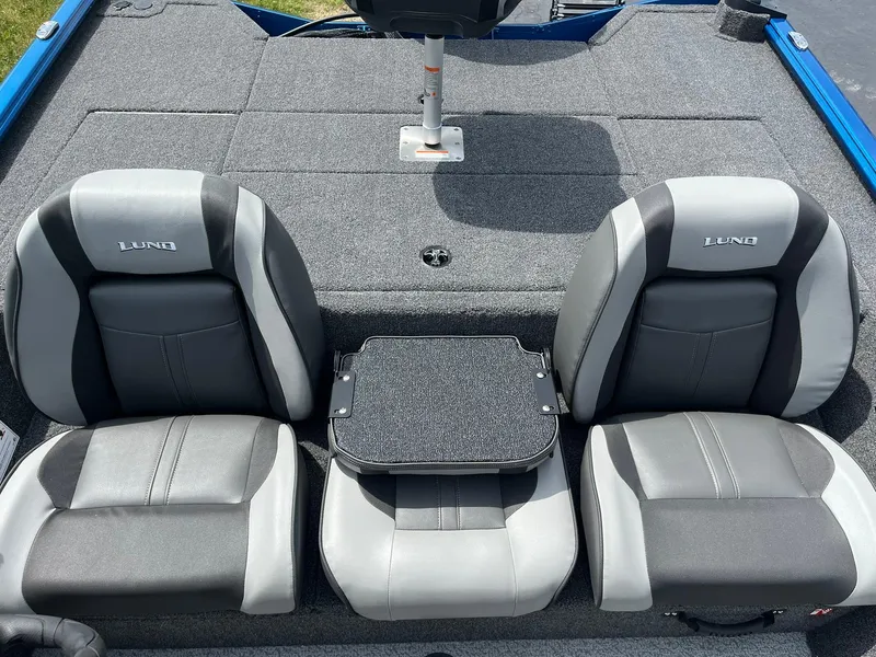 Slide: The Image of 2026 Lund 1775 Renegade SS boat interior with gray seats and small table. - 8