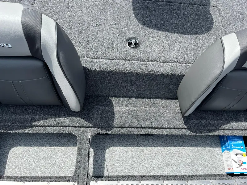 Slide: The Image of 2026 Lund 1775 Renegade SS boat interior with gray seating and carpeted flooring. - 9