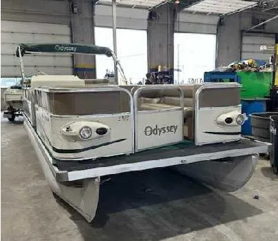 Slide: The Image of 2003 Odyssey Pontoons 2302 boat in a warehouse setting. - 1