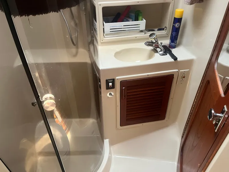 Slide: The Image of 1987 Tiara Yachts 3600 bathroom with shower, sink, and storage cabinet. - 31