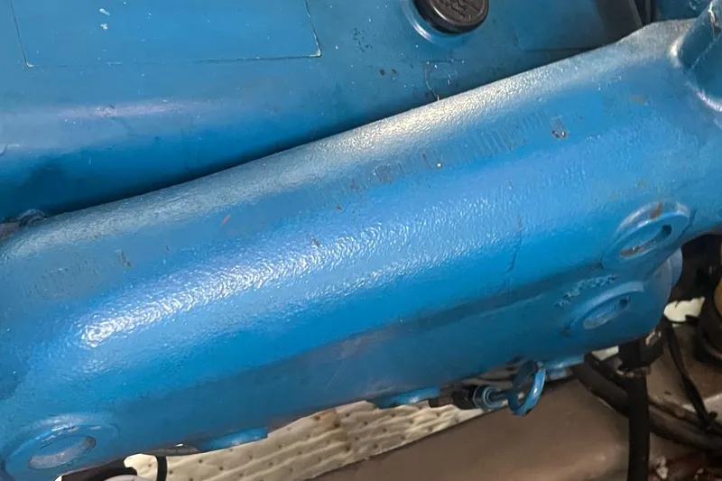 Slide: The Image of Close-up of a blue engine component from a 1987 Tiara Yachts 3600. - 45