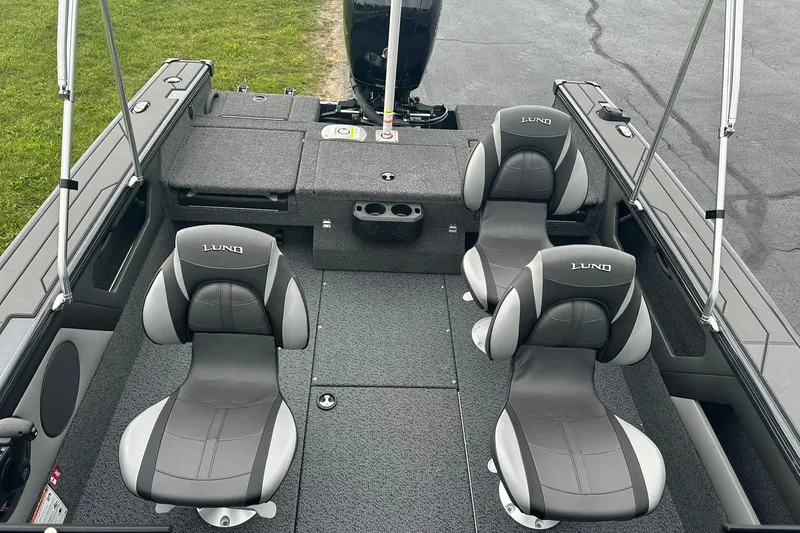 Slide: The Image of 2026 Lund 1775 Crossover XS boat interior with four gray seats and spacious layout. - 14