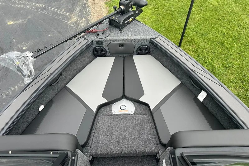 Slide: The Image of 2026 Lund 1775 Crossover XS boat interior with seating and trolling motor. - 20