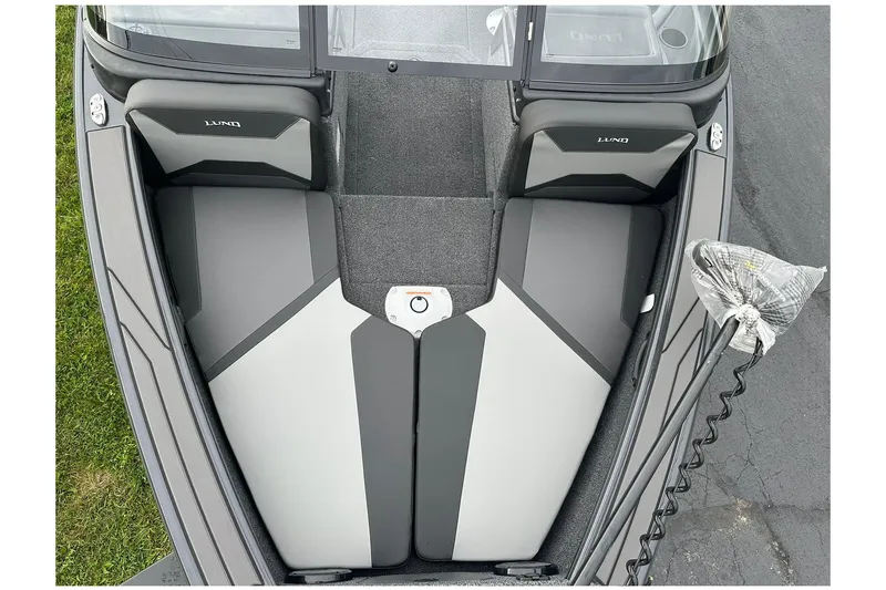 Slide: The Image of 2026 Lund 1775 Crossover XS boat interior, featuring sleek seating and modern design. - 21