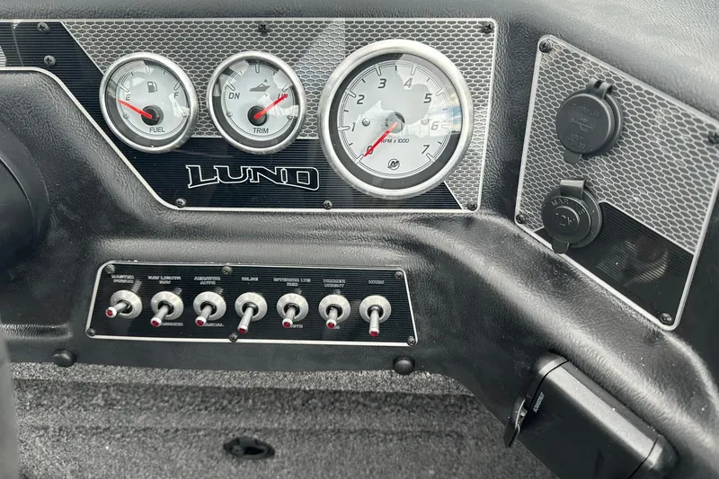 Slide: The Image of Dashboard of 2026 Lund 1775 Crossover XS boat with gauges and switches. - 28