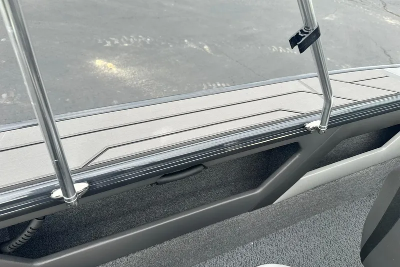 Slide: The Image of 2026 Lund 1775 Crossover XS boat interior with sleek design and sturdy railing. - 30