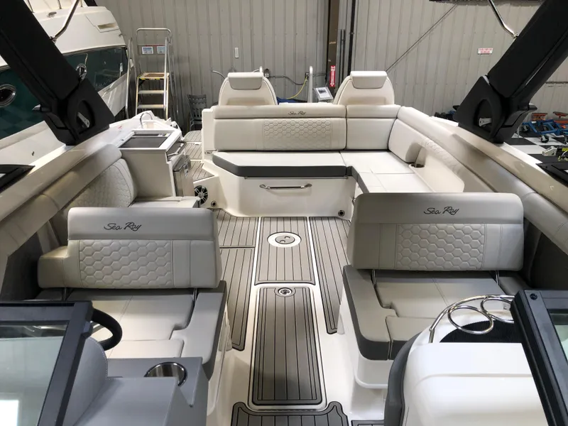 Slide: The Image of 2025 Sea Ray SDX 290 boat interior with luxurious seating and modern design. - 14
