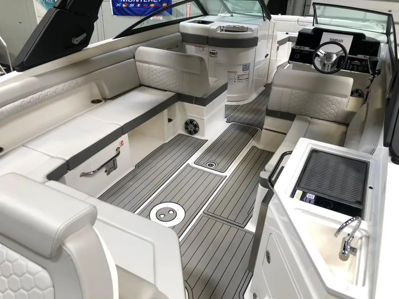 Slide: The Image of 2025 Sea Ray SDX 290 boat interior with luxurious seating and modern amenities. - 4