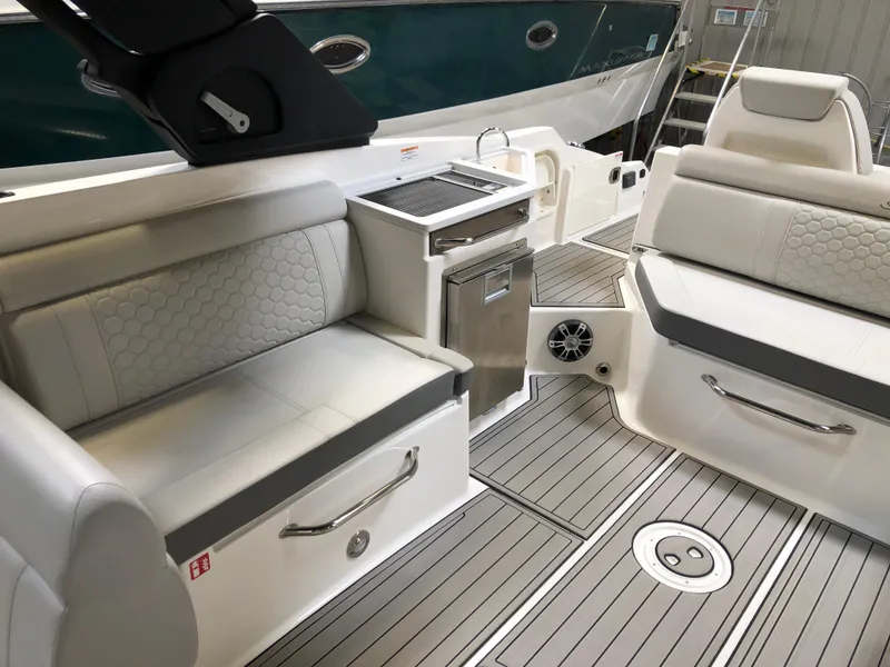 Slide: The Image of 2025 Sea Ray SDX 290 boat interior with sleek seating and modern amenities. - 6