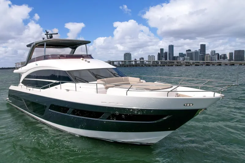 Slide: The Image of Princess Y78 yacht cruising near city skyline, 2021 model. - 1