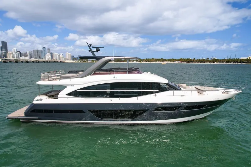 Slide: The Image of Princess Y78 2021 luxury yacht cruising on a sunny day with city skyline in the background. - 3