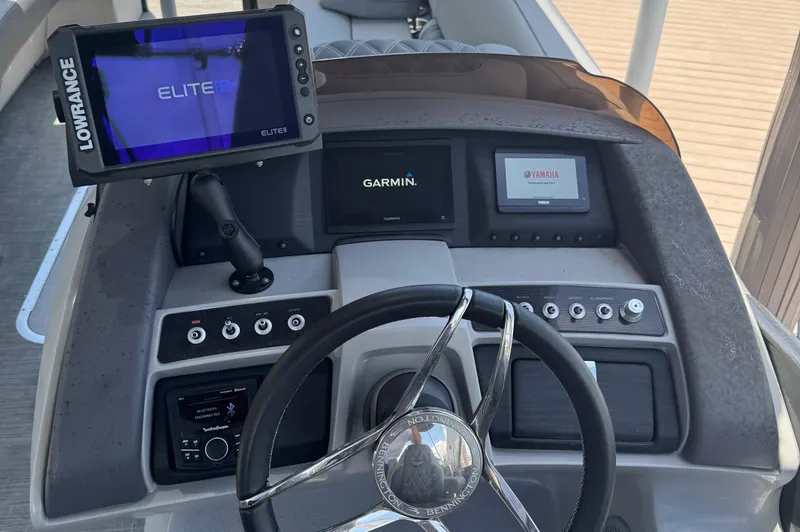 Slide: The Image of Dashboard of 2022 Bennington RX 25 RXFBA with Lowrance and Garmin displays. - 11