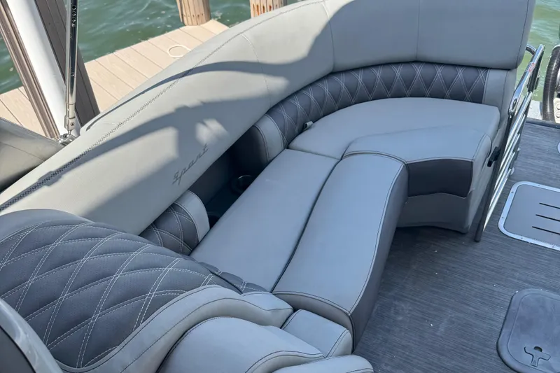 Slide: The Image of Luxurious seating on 2022 Bennington RX 25 RXFBA boat, featuring elegant gray upholstery. - 14