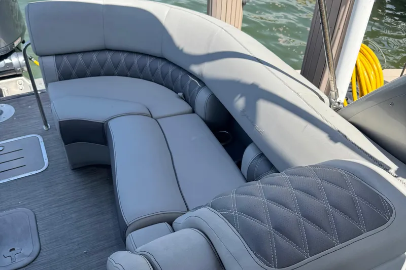 Slide: The Image of Luxurious seating on 2022 Bennington RX 25 RXFBA boat, featuring elegant gray upholstery. - 15